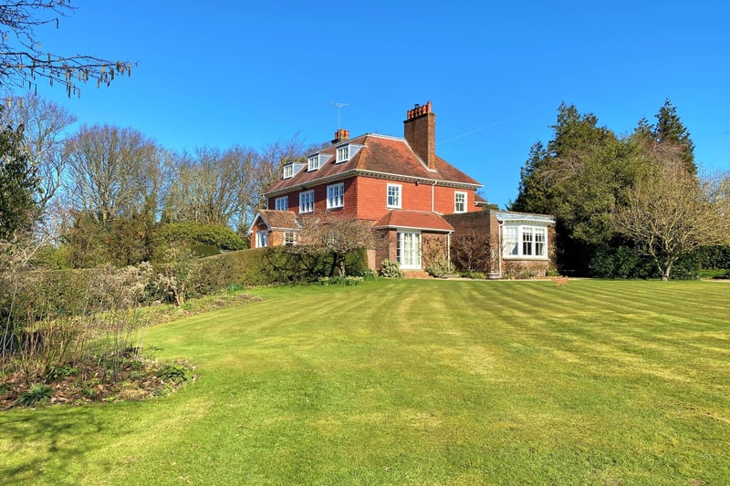 The three-storey property has more than seven acres of grounds, with views over the Brede Valley