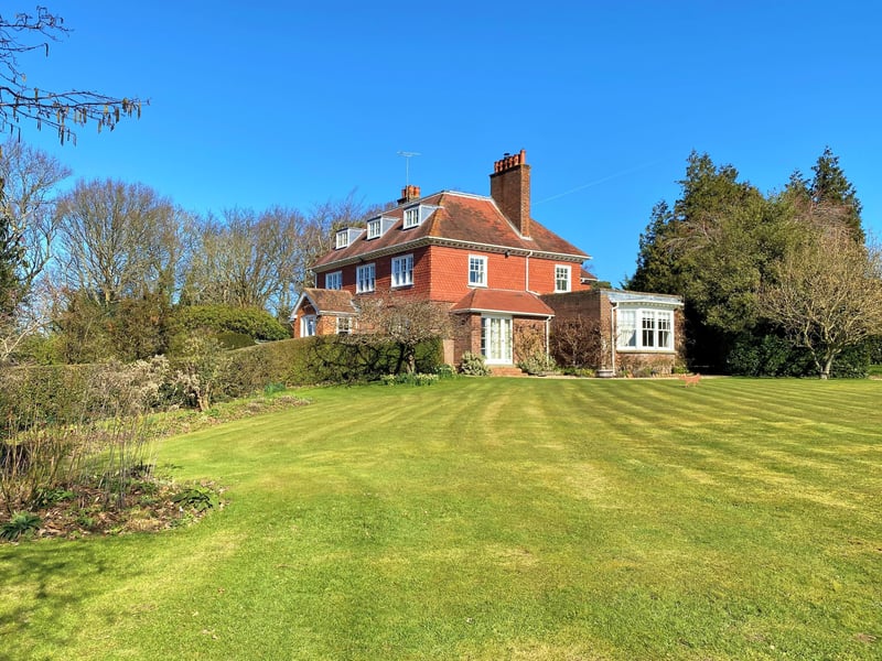 The three-storey property has more than seven acres of grounds, with views over the Brede Valley
