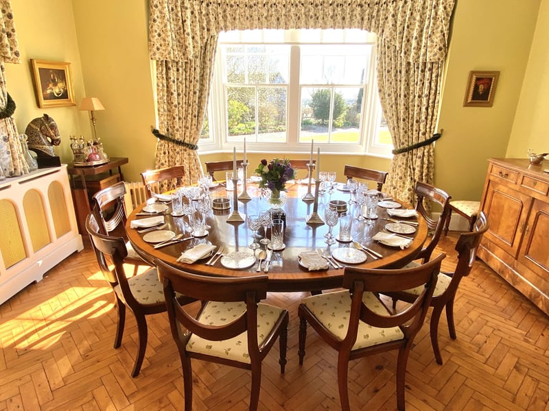 The dining room with parquet flooring, said to be one of the property's original period features