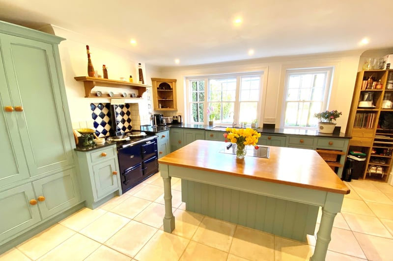 A central island unit and AGA feature in the kitchen-breakfast room. The house also has a wine cellar