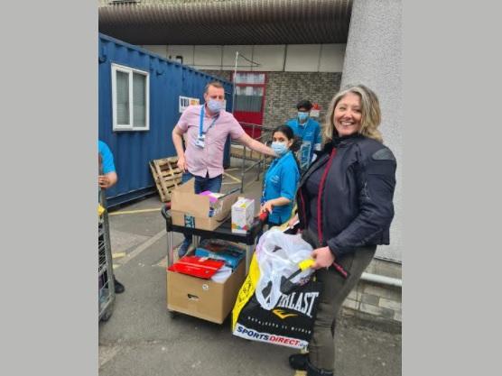 Delivering the gifts to the hospital's charity team