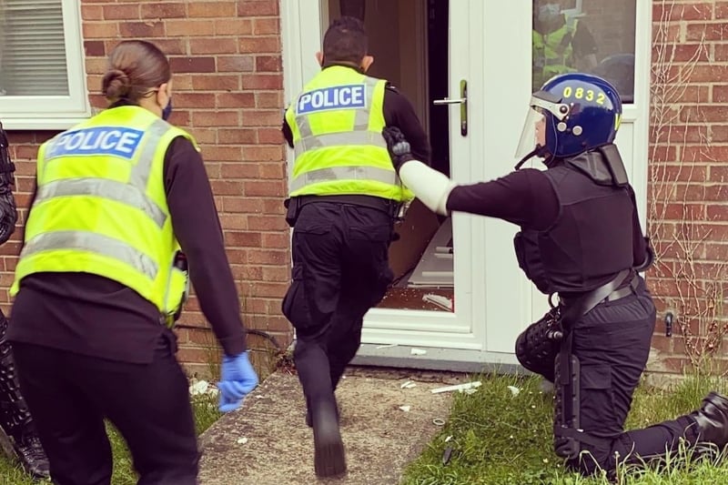 Police targeting county lines drug dealing operations raid a property.