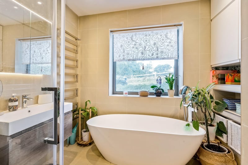 The property features stylish bathroom suites. Picture: Savills Haywards Heath.