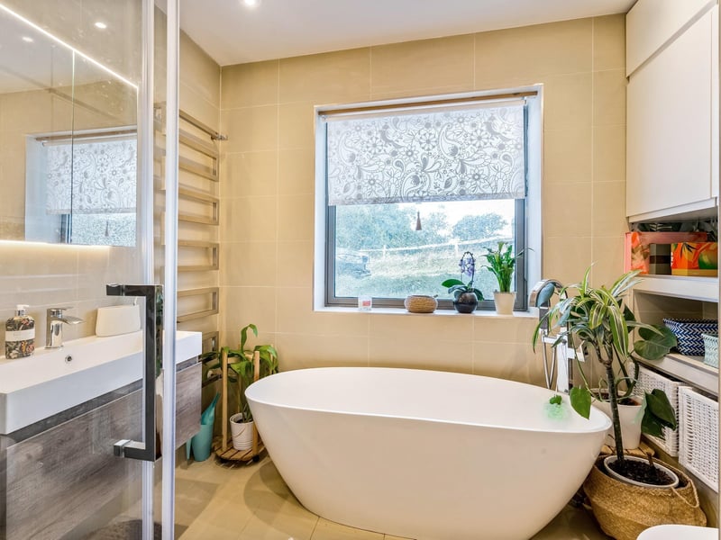 The property features stylish bathroom suites. Picture: Savills Haywards Heath.