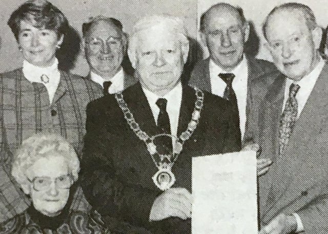 Councillor Pat Brannigan, chairman of Armagh District Council recieved the certificate for the runner-up award won by Tandragee for the Best Kept Small Town in Northern Ireland in 1993. Also included are local councillors and residents