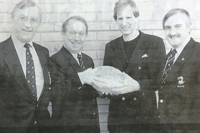 Dermot Maguinness of Iveagh Fuels hands over a sponsored ball to the president of Lisburn Rugby Club, Robin Cruikshanks before a match in 1993. Also included are Howard Smyth and Leslie Mills