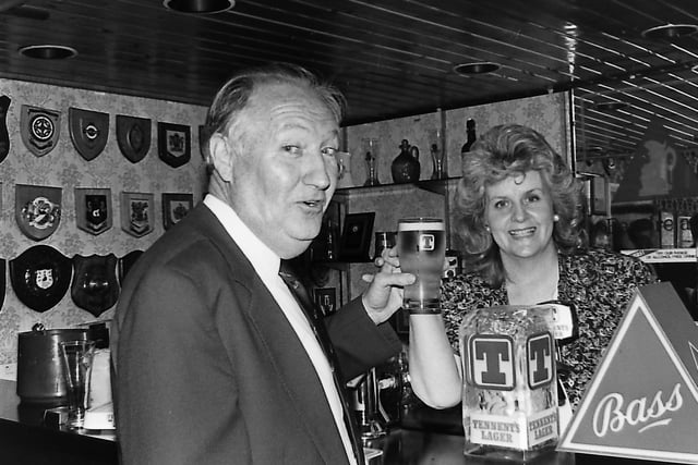 Bobby Howard, president of the Irish Hockey Union, celebrates the game's largest ever financial package with a pint of the sponsor's brew, poured by Pat Burke at a reception held the Ulster brewery in October 1989. Picture: News Letter archives