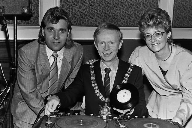 Pictured in October 1989 is the Lord Mayor of Belfast Reg Empey, singer Roy Leckey and fundraiser Nina Wardle. The Lord Mayor had been the first person to hear a new record which had been produced in aid of the Shankill Activity Centre by the Shankill Musicians' Collective. Picture: News Letter archives