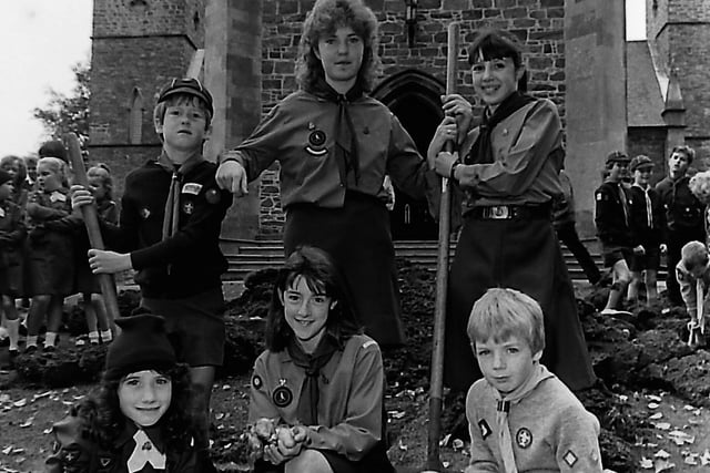 First Hillsborough Scouts and Guides get ready to plant hundreds of daffodil bulbs in the grounds of Hillsborough Parish Church in October 1989 to mark the 45th anniversary of the founding of the group. Pictured are, back row, from left, Ian Gilliland, nine, Joanne Helm, 12, and Victoria Mercer, 11, while at the front are Heather Hamilton, nine, Joy Sparks, 13, and Alan Baird, seven. Picture: News Letter archives