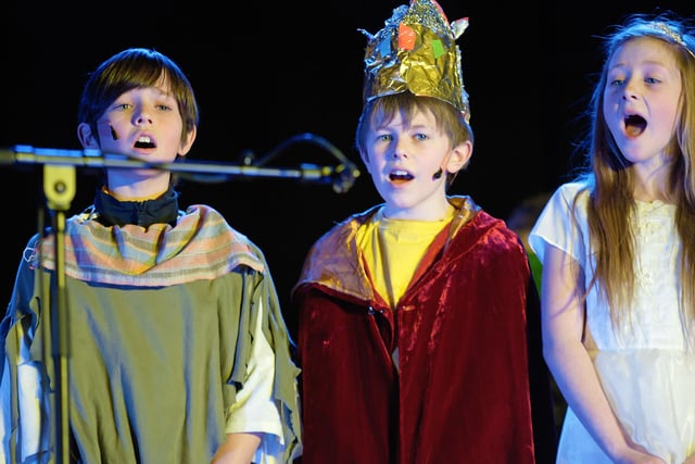 Lorcan, Odhran and Caitlin sing at Gaelscoil an Chaistil Christmas Concert