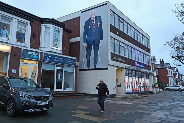 A mural of Captain Sir Tom Moore has been painted on a building in Southport.