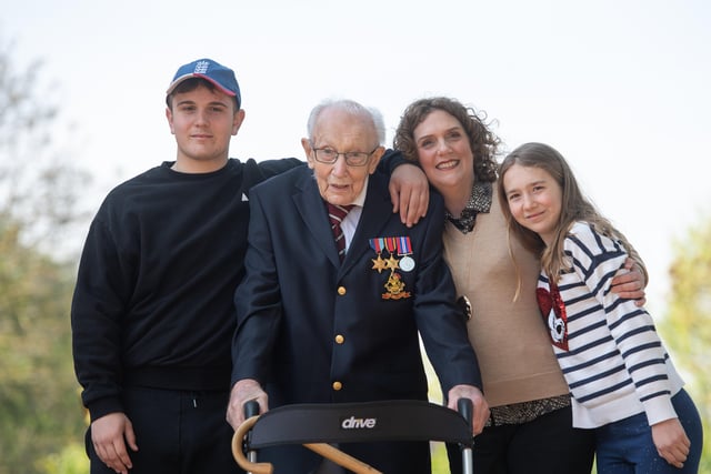 The then 99-year-old war veteran Captain Tom Moore, with (left to right) grandson Benji, daughter Hannah Ingram-Moore and granddaughter Georgia, at his home in Marston Moretaine, Bedfordshire