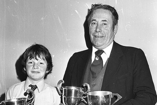 Mr P J Harkin from Donemana, Co Tyrone, and his 12-year-old son Thomas with the trophies won by their Blackface rams at the Ulster Ram Breeders’ Association annual dinner and prize distribution at Ballymena in November 1981. Picture: Farming Life/News Letter archives