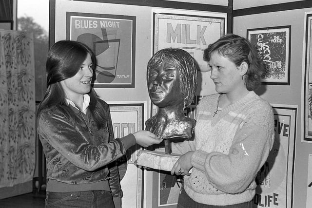 Marian Walsh and Annmarie Duddy, who worked in the Arts Council Centre on the Stranmillis Road, Belfast, pictured in January 1981 admiring some of the exhibits in the CSE art and design work exhibition in the Schools’ Gallery. Picture: News Letter archives