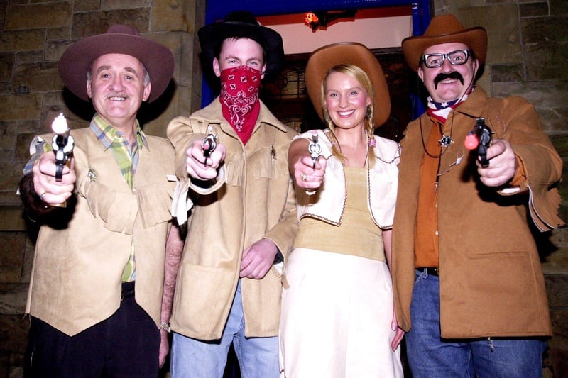 Stick 'em up! Gerry McCloskey and the Monico Bar Gang dressed up as cowboys - and cowgirl - as part of the Halloween festivities.