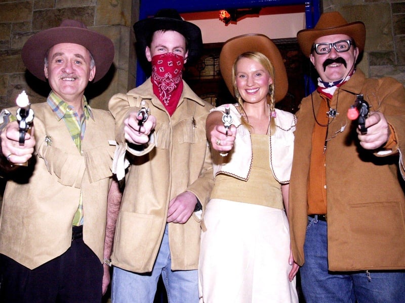 Stick 'em up! Gerry McCloskey and the Monico Bar Gang dressed up as cowboys - and cowgirl - as part of the Halloween festivities.