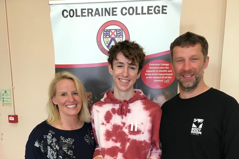 Callum Quigg receiving his results with his parents