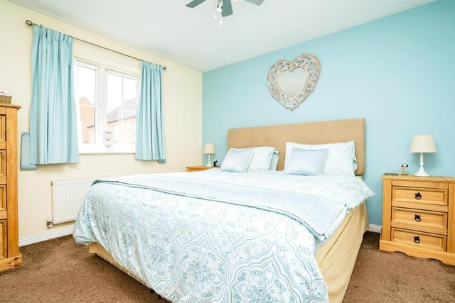 The master bedroom at the Pippin Close property is warm and relaxing. Facing the front of the house, it boasts fitted wardrobes and a carpeted floor.