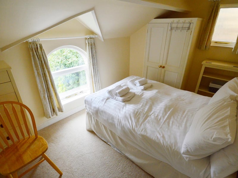 One of the three first-floor double bedrooms.