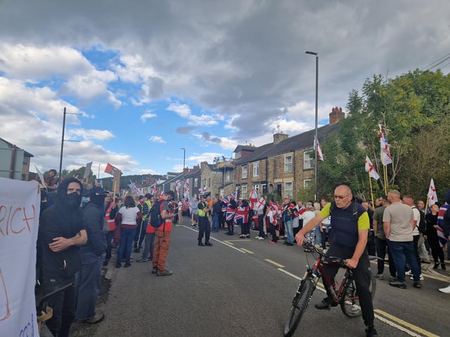 Later some of the protesters holding Union Jack and English flags started walking onto the road and a road closure was put in place.