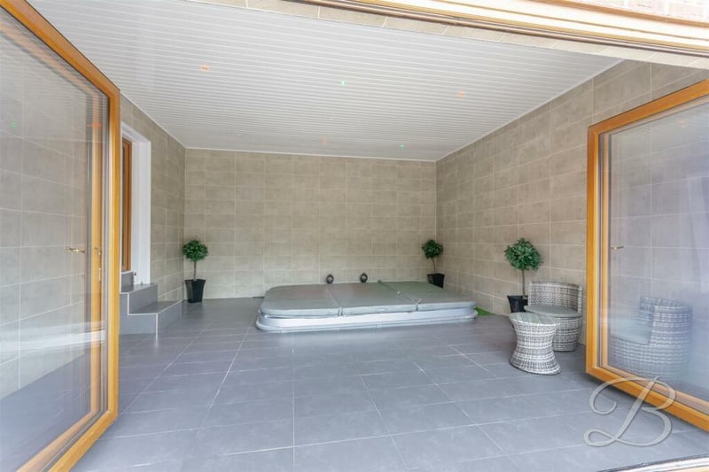 The large hot-tub room is so cool, if you know what we mean! Wow! The bi-folding doors lead directly outside.