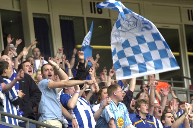 Wednesday supporters fly the flag during the League One play-off final against Hartlepool United at Cardiff's Millennium Stadium in May 2005.