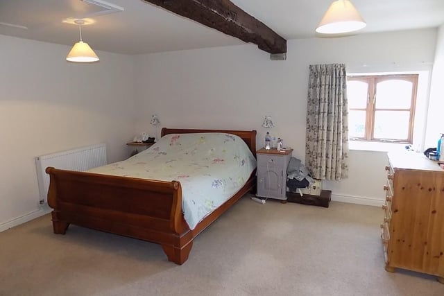 Two of the four bedrooms have built-in wardrobes, exposed ceiling beams and ensuites.