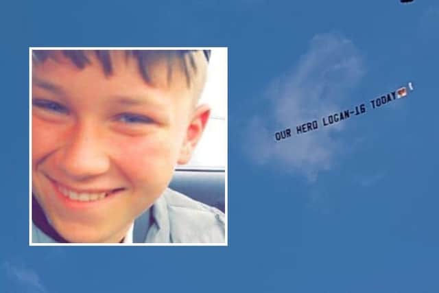 A flypast plane banner reading "OUR HERO LOGAN - 16 TODAY" featured as part of the event