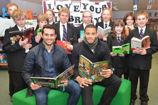 Chesterfield players Sam Hird and Aaron Chapman visit the library at Newbold Community School in 2014
