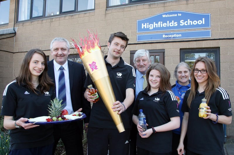 Derbyshire County Council Cabinet Member Mike Longden (centre) celebrates news of the Olympic Torch lunch stop at Highfields School with headteacher Eddie Wilkes (second left), sports co-ordinator Jayne Allen (second right) and school sports ambassadors (from left) Debs Greer (18), Calum Kinsella (18), Abi Akehurst (17) and Emma Erskine (17).