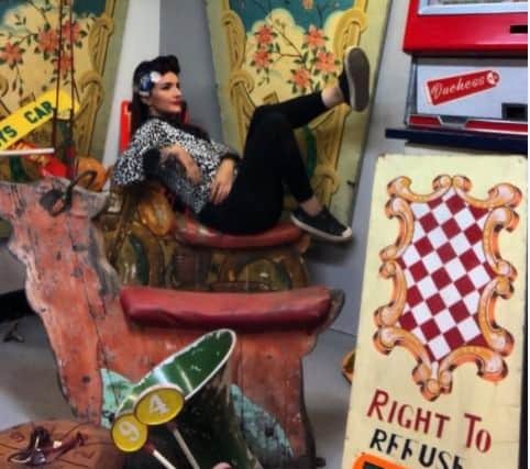 Suzie Kujawinski surrounded by salvaged antique items. Photo courtesy of Instagram/theluckymagpiesalvage