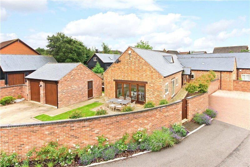 This is a four bedroom, four bathroom barn style property with electric gates, off street parking and a detached double garage, situated in a private development. The accommodation includes an open plan kitchen and breakfast room, a sitting room with a log burning stove, a dining room, and a family room.