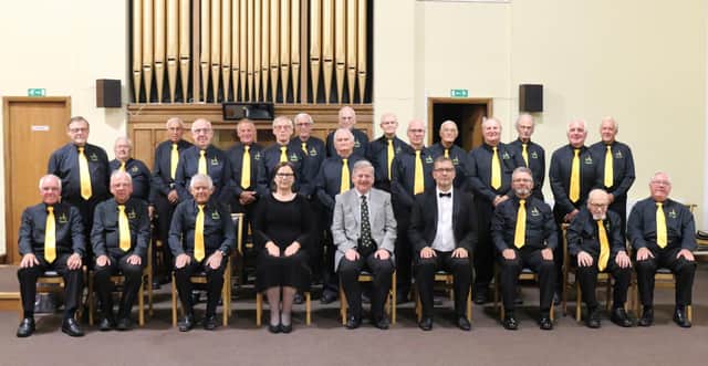 Martin Thacker, president of the choir, is pictured centre of the front row between Andris Ugulis and Janina Ugule, musical director and accompanist. Mike Spriggs, the choir's chairman, is on the back row, second from the right (photo: Paul Truscott Photography)