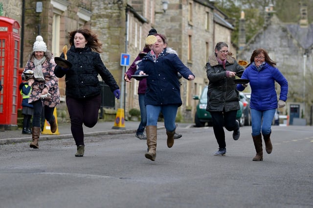 Locals have fun at the annual Winster Pancake Race.