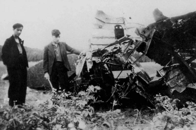 Two youths inspecting the wreck of a British aircraft during the Second World War. The photo is thought to have been taken in  the Elwick area. Photo: Hartlepool Library Service