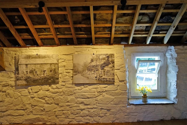 The pictures on the walls tell their own story of the cottage's past.
