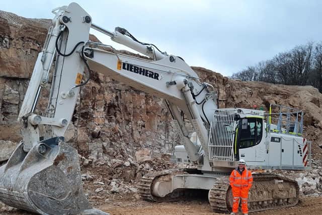 Longcliffe Quarry Operative, Lee Gamble with the new excavator which he operates at Brassington Moor