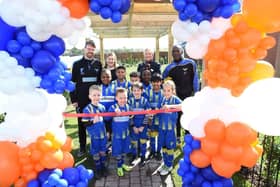 The U8s from Field Lane FC cut the ribbon to the showhome at Bellway’s The Meadows development in Boulton Moor, watched by, from left, team coach Martin Broer, Bellway Sales Manager Heidi Higgins, Bellway Sales Advisor Debbie Newey and team coach Roy Johnson.