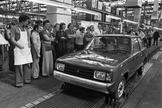 Workers at Linwood watch as the first new Chrysler Sunbeam car rolls of the production line/assembly line in August 1977.