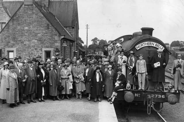 Villagers gathered around the Northern Belle as the steam locomotive tours Britain in 1935. (Photo by London Express/Getty Images)
