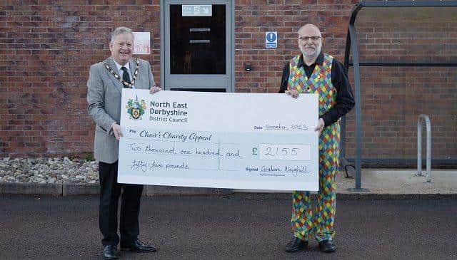  Pictured (from left): Cllr Martin Thacker MBE accepting the cheque from Graham Weighill.  