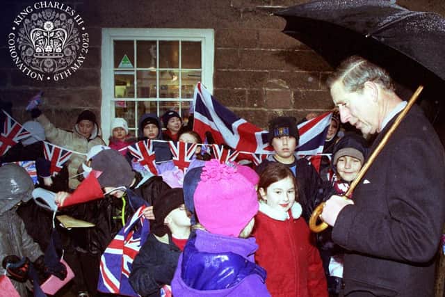 King Charles, then Prince of Wales, meets local children on a visit to Cromford Mills.