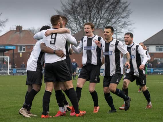 Heanor Town celebrate in their 4-3 win over Belper United.
