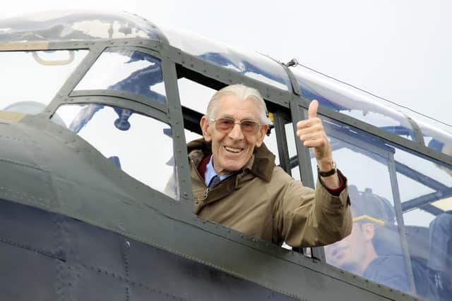 Derbyshire press photographer George Eyre, pictured in a Lancaster bomber.