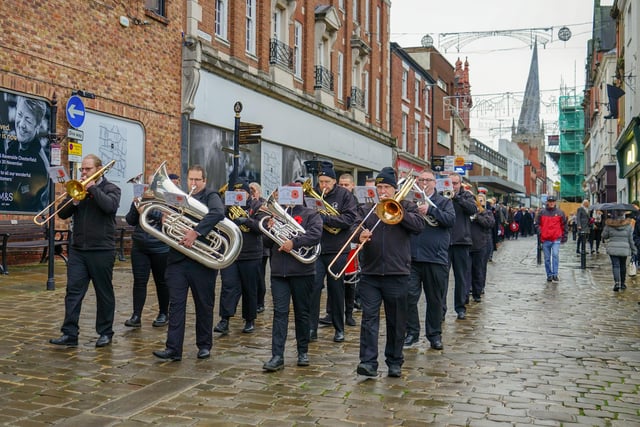 Band leads the parade down the High Street in Chesterfield.