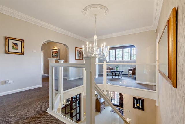 You enter the home into a "magnificent" reception hall with attractive porcelain tiled flooring and a feature staircase with a galleried landing and glass balustrades.