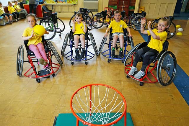 Erin Woodhead, Stanley Shinwell, Max Norris, Sophie Courtney playing wheelchair basketball at the Tibshelf Infant School sports inclusive activity day.