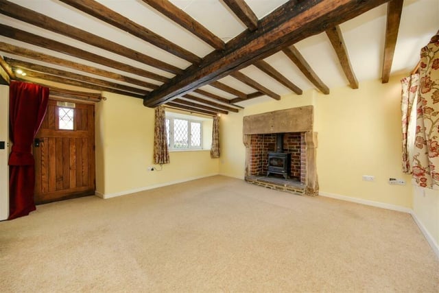 This characterful room boasts a stone-built fireplace that houses a log burning stove.