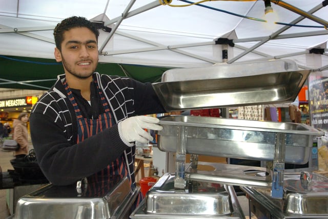 Asian market Fargate, Sheffield in 2004. Harrres Ali gets his curries ready this morning