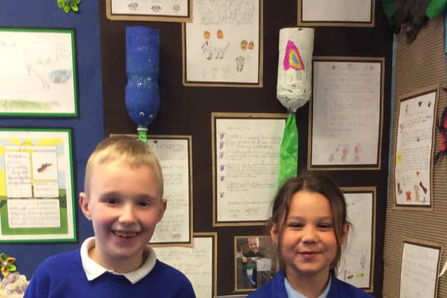 Pupils from Ironville and Codnor Park Primary School with one of their community displays in school